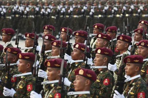 Military officers march during a parade to commemorate Myanmar's 78th Armed Forces Day in Naypyitaw, Myanmar, on March 27, 2023. Myanmar’s military government on Wednesday Feb. 14, 2024 revealed how it will implement its newly activated conscription law, saying it will draft 60,000 young men and women yearly for military service, and that call-ups will begin after the April festival marking the country’s traditional New Year. (AP Photo/Aung Shine Oo, File)