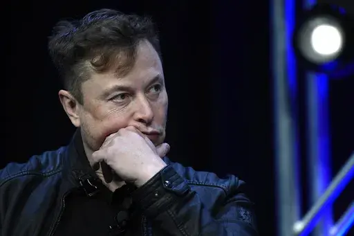 Tesla and SpaceX chief executive officer Elon Musk listens to a question as he speaks at the SATELLITE Conference and Exhibition in Washington, March 9, 2020. (AP Photo/Susan Walsh, File)
