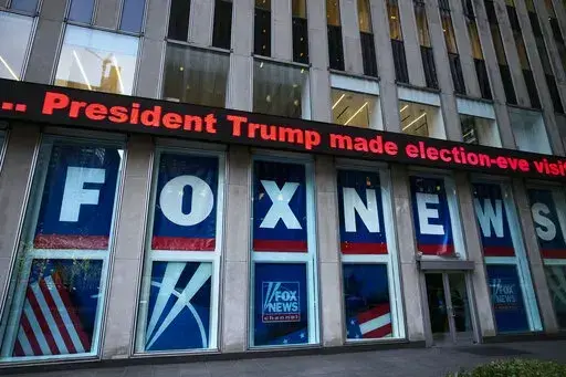 A headline about President Donald Trump is displayed outside Fox News studios, on Nov. 28, 2018, in New York. Attorneys for the cable news giant argued in a counterclaim unsealed, Thursday, Feb. 16, 2023, that a $1.6 billion defamation lawsuit against Fox News by Dominion Voting Systems over the network’s coverage of the 2020 presidential election is an assault on the First Amendment. (AP Photo/Mark Lennihan, File)