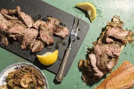 This image released by Milk Street shows a recipe for bocadillos with flank steak and mushrooms. (Milk Street via AP)