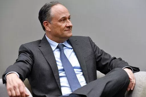 Second gentleman Doug Emhoff listens as he meet with women entrepreneurs for a panel discussion while visiting Mi Casa Resource Center in Denver, on March 11, 2022. The White House says Emhoff has tested positive for COVID-19. Vice President Kamala Harris tested negative, but is curtailing her schedule as a result of her husband’s positive test. (Jason Connolly/Pool via AP)