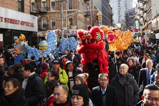 Revelers gather to attend the parade for the Chinese New Year "The Dragon" in the Chinatown neighborhood of Manhattan, Sunday, Feb. 25, 2024, in New York. (AP Photo/Eduardo Munoz Alvarez)