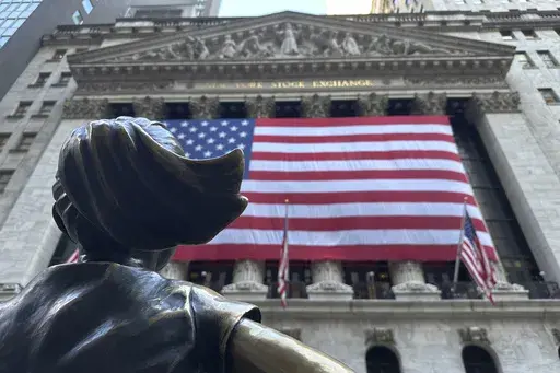 The Fearless Girl statues faces the New York Stock Exchange on July 2, 2024, in New York. (AP Photo/Peter Morgan)