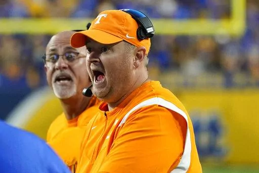 Tennessee head coach Josh Heupel yells to an official after Pittsburgh wide receiver Jared Wayne (5) made a catch along the sideline that was ruled a catch during overtime of an NCAA college football game, Saturday, Sept. 10, 2022, in Pittsburgh. After review, the catch call was overturned. Tennessee won 34-27 in overtime. (AP Photo/Keith Srakocic)