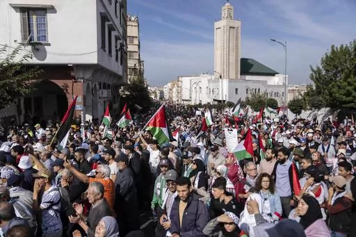 Thousands of Moroccans take part in a protest in solidarity with Palestinians in Gaza and against normalisation with Israel, in Casablanca, Morocco, Sunday, Oct. 29, 2023. Countries in the Middle East that have normalized or are considering normalizing relations with Israel are coming under growing public pressure to cut those ties because of Israel's war with Hamas. The protesters' demands present an uncomfortable dilemma for governments that have enjoyed the benefits of closer military and eco