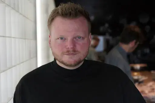 Rasmus Munk, co-owner and chef of Alchemist restaurant, poses inside Alchemist’s kitchen, in Copenhagen, Denmark, Monday May 6, 2024. The Danish Michelin-starred chef has teamed up with the Florida-based startup Space Perspective to take fine-dining to our upper atmosphere in late 2025. Six guests are set to ascend to the stratosphere, where they will enjoy an immersive dining experience served up by chef Rasmus Munk. (AP Photo/James Brooks)