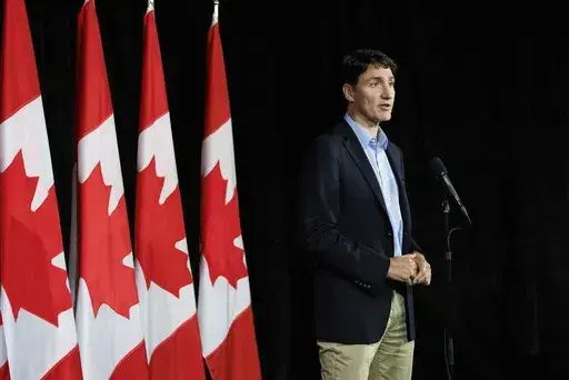 Canadian Prime Minister Justin Trudeau speaks with reporters during a news conference at the Federal ministers cabinet retreat in Halifax, Nova Scotia, Monday, Aug. 26, 2024. (Kelly Clark/The Canadian Press via AP)