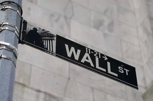A Wall Street sign is shown in the Financial District, on Oct. 13, 2021, in the Manhattan borough of New York. Stocks are opening lower on Wall Street on Friday, June 3, 2022, putting indexes back into the red for the week. (AP Photo/John Minchillo, File)