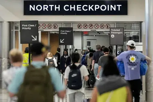 Travelers move through Hartsfield-Jackson Atlanta International Airport ahead of Memorial Day, Friday, May 24, 2024, in Atlanta.(AP Photo/Mike Stewart)