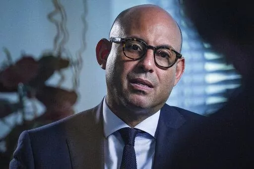 Simon Stiell sits for an interview to discuss his new role as the executive secretary of the U.N. Framework Convention on Climate Change, Thursday, Sept. 22, 2022, at U.N. headquarters. Stiell was the environment and climate resilience minister on the small island nation of Grenada until a few weeks ago. It’s now his job to make sure the world cuts about half emissions of heat-trapping gases — which are helping trigger unprecedented frequent weather disasters — in just eight years, or, as 