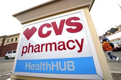 A CVS store sign is displayed in Pittsburgh on Friday, Feb. 3, 2023. CVS Health is plunging deeper into primary care services, buying Oak Street Health for approximately $10.6 billion. The drugstore chain said Wednesday, Feb. 8, 2023, it would pay $39 per share in cash for each share of Oak Street Health in a deal expected to close this year. (AP Photo/Gene J. Puskar)