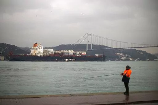 Cargo ship Oakland crosses the Bosphorus strait towards the Marmara sea after departing from Russia's Novorossiysk port, in Istanbul, Tuesday, March 1, 2022. Turkey, which is trying to balance its support for Ukraine with its fragile economic ties to Russia, said Monday it is implementing an international convention that allows the country to shut down the straits at the entrance of the Black Sea to warships, to avoid an escalation of the conflict. (AP Photo/Francisco Seco, File)