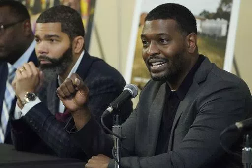 EPA Administrator Michael S. Regan, right, addresses a roundtable of Jackson-area businesspeople, community leaders, residents and educators, as Jackson Mayor Chokwe Antar Lumumba, left, listens, Nov. 15, 2022, at Jackson State University, in Jackson, Miss. The EPA said Monday, May 6, 2024, that it found “insufficient evidence” that racial discrimination shaped decisions made by two Mississippi agencies about water system funding for the majority-Black city of Jackson. (AP Photo/Rogelio V. S