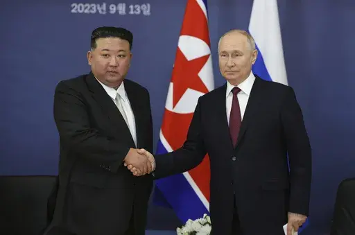 Russian President Vladimir Putin, right, and North Korean leader Kim Jong Un shake hands during their meeting at the Vostochny cosmodrome outside of Tsiolkovsky, in the far eastern Amur region, Russia on Sept. 13, 2023. (Vladimir Smirnov/Sputnik Kremlin Pool Photo via AP, File)