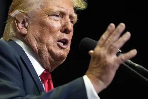 Republican presidential candidate former President Donald Trump speaks at a campaign rally, July 20, 2024, in Grand Rapids, Mich. The Trump campaign has spent the last year-and-half viciously attacking Joe Biden. But they have also been preparing for the possibility that Biden might exit the race after last month's disastrous debate performance. On Sunday, they unleashed a bevy of attacks against Vice President Kamala Harris following Biden's stunning announcement that was dropping his bid. The 