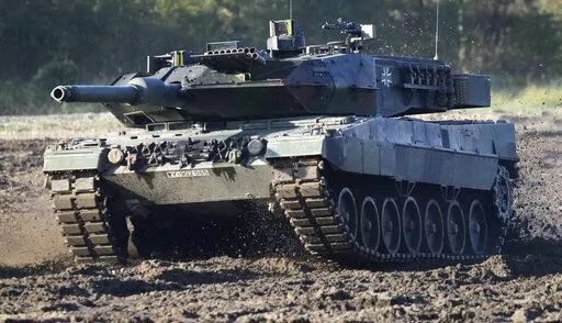 A Leopard 2 tank is pictured during a demonstration event held for the media by the German Bundeswehr in Munster near Hannover, Germany, Wednesday, Sept. 28, 2011. Chancellor Olaf Scholz is expected to announce Wednesday, Jan. 25, 2023 that his government will approve supplying German-made battle tanks to Ukraine. The long-awaited decision comes after U.S. officials said Tuesday that a preliminary agreement had been struck for the United States to send M1 Abrams tanks to help Kyiv push back Russ