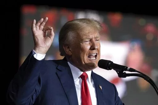 Former President Donald Trump speaks at the Minden Tahoe Airport in Minden, Nev., on Oct. 8, 2022. New York’s attorney general has asked a judge Thursday, Oct. 13, to bar the Trump Organization from selling or transferring assets without court approval while a legal battle plays out over her fraud allegations against the former president’s company. (AP Photo/José Luis Villegas, Pool, File)