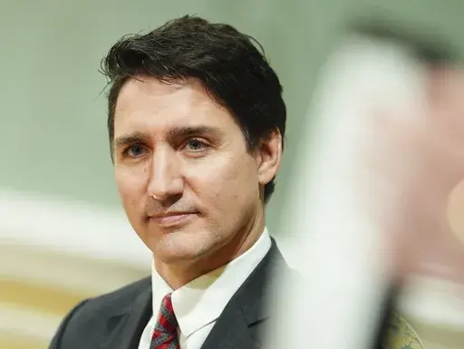 Prime Minister Justin Trudeau looks on during a cabinet swearing-in ceremony at Rideau Hall in Ottawa, on Friday, Dec.20, 2024.(Sean Kilpatrick /The Canadian Press via AP)
