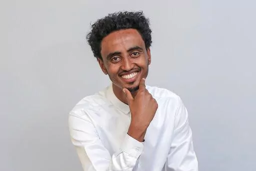 Freelance video journalist Amir Aman Kiyaro, who is accredited to The Associated Press and has been in detention since November 2021 without charges, poses for a photograph in Ethiopia on Oct. 17, 2021. Ethiopia is being urged on Monday, March 28, 2022, to uphold its international commitments to the freedoms of expression and the press as two lawmakers in the U.S. Congress joined press freedom advocates in calling for the immediate release of Kiyaro. (AP Photo, File)