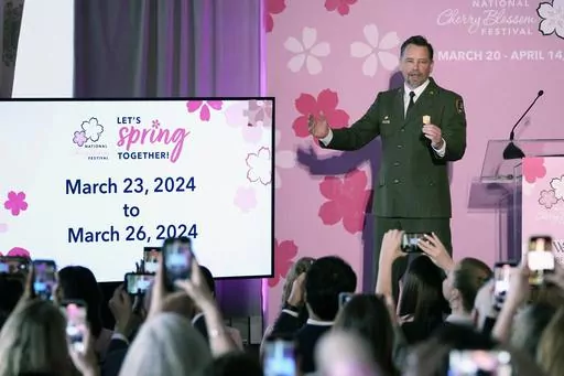 Jeffrey Reinbold, National Park Service Superintendent for the National Mall and Memorial Parks, announces the peak bloom for the cherry blossoms during a news conference in Washington, Thursday, Feb. 29, 2024. (AP Photo/Susan Walsh)