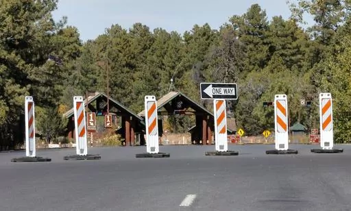 The Grand Canyon National Park entrance is blocked off, in Tusayan, Ariz., Oct. 8, 2013, because of a partial government shutdown. Arizona's Grand Canyon National Park and all five national parks in Utah will remain open if the U.S. government shuts down, Sunday, Oct. 1, 2023. Arizona Gov. Katie Hobbs and Utah Gov. Spencer Cox say that the parks are important destinations and local communities depend on dollars from visitors. (AP Photo/Matt York, File)