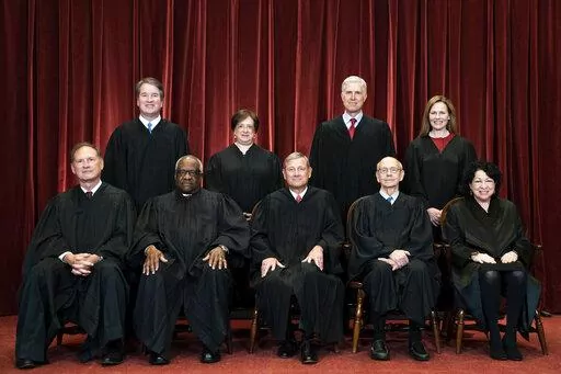 Members of the Supreme Court pose for a group photo at the Supreme Court in Washington, April 23, 2021. Seated from left are Associate Justice Samuel Alito, Associate Justice Clarence Thomas, Chief Justice John Roberts, Associate Justice Stephen Breyer and Associate Justice Sonia Sotomayor, Standing from left are Associate Justice Brett Kavanaugh, Associate Justice Elena Kagan, Associate Justice Neil Gorsuch and Associate Justice Amy Coney Barrett. (Erin Schaff/The New York Times via AP, Pool, F
