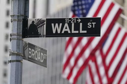 A street sign is seen in front of the New York Stock Exchange in New York, Tuesday, June 14, 2022. Wall Street inched lower ahead of the opening bell Friday, Jan. 12, 2024 and oil prices jumped after the U.S. and British militaries bombed Yemen in retaliation for Houthi attacks in the Red Sea that have disrupted international trade. (AP Photo/Seth Wenig, File)
