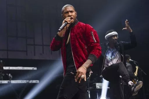 Usher performs at Power 105.1's Powerhouse 2016 at Barclays Center in New York on Oct. 27, 2016. He was added to the lineup for the Essence Festival of Culture, which runs July 4-7 in New Orleans. (Photo by Scott Roth/Invision/AP, File)