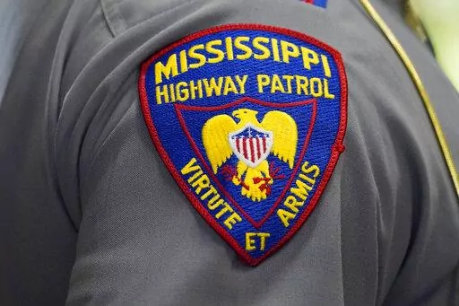 The shoulder patch of a Mississippi Highway Patrol officer is photographed during a ceremony in Jackson, Miss., May 17, 2022. An incident involving a white Mississippi Highway Patrol officer and three Black men is under investigation after a viral video showed the officer putting a handcuffed man into a chokehold and wrestling him into a ditch, Friday, Aug. 5, 2022, in McComb, Miss. (AP Photo/Rogelio V. Solis)