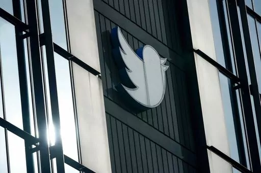 A Twitter logo hangs outside the company's offices in San Francisco, on Dec. 19, 2022. Russia, China and Iran are exploiting recent changes at Twitter to spread disinformation faster and farther. Under new owner Elon Musk, Twitter recently ended its policy of labeling foreign propaganda agencies like RT or Sputnik. (AP Photo/Jeff Chiu, File)