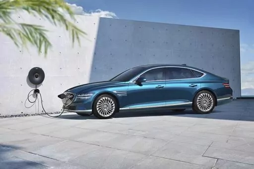 This photo provided by Hyundai shows the 2023 Genesis G80 Electrified, a midsize luxury sedan with an EPA-estimated range of 282 miles. (Courtesy of Hyundai Motor America via AP)