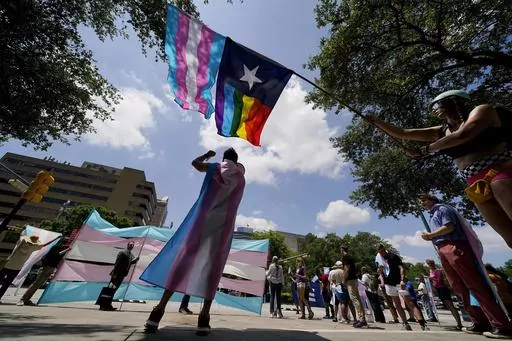Demonstrators gather on the steps to the Texas Capitol to speak against transgender-related legislation bills being considered in the Texas Senate and House, May 20, 2021, in Austin, Texas. The Texas Supreme Court will allow the new state law banning gender-affirming care for minors to take effect on Friday, Sept. 1, 2023, setting up Texas to be the most populous state with such restrictions on transgender children. (AP Photo/Eric Gay, File)