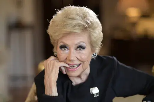 Actress Mitzi Gaynor poses in her apartment Wednesday, May 26, 2021, in Beverly Hills, Calif. Gaynor, among the last survivors of the so-called golden age of the Hollywood musical, died of natural causes in Los Angeles on Thursday, Oct. 17, 2024. She was 93. (AP Photo/Mark J. Terrill, File)