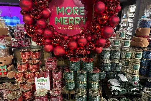 An arrangement of holiday themed scented candles is shown at a Bath and Body Works store on Wednesday, Oct. 9, 2024, in New York. (AP Photo/Peter Morgan)