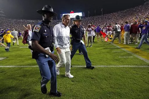Alabama head coach Nick Saban, center, walks off the field after an NCAA college football game against LSU in Baton Rouge, La., Saturday, Nov. 5, 2022. (AP Photo/Tyler Kaufman)