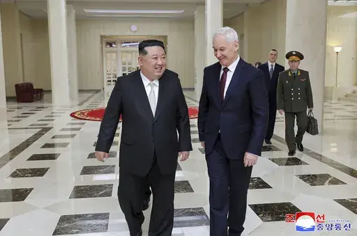 In this photo provided by the North Korean government, North Korean leader Kim Jong Un, left, meets Russian Defense Minister Andrei Belousov in Pyongyang, North Korea Friday, Nov. 29, 2024. Independent journalists were not given access to cover the event depicted in this image distributed by the North Korean government. The content of this image is as provided and cannot be independently verified. Korean language watermark on image as provided by source reads: "KCNA" which is the abbreviation fo