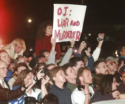 A crowd reacts to O.J. Simpson leaving Los Angeles County Superior Court, Tuesday, Feb. 4, 1997, in Santa Monica, Calif. after hearing the verdict in the wrongful-death civil trial against O.J. Simpson. Simpson was found liable in the deaths of Nicole Brown Simpson and Ron Goldman. Simpson, the decorated football superstar and Hollywood actor who was acquitted of charges he killed his former wife and her friend but later found liable in a separate civil trial, has died. He was 76. (AP Photo/Susa