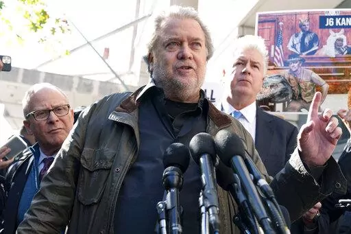 Steve Bannon, center, a longtime ally of former President Donald Trump and convicted of contempt of Congress,  accompanied by his attorneys David Schoen, left, and Evan Corcoran, right, speaks to the media as he leaves the federal courthouse on Friday, Oct. 21, 2022, in Washington. Bannon was sentenced to 4 months behind bars for defying a Jan. 6 committee subpoena. ( AP Photo/Jose Luis Magana)