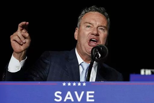 Wisconsin Republican gubernatorial candidate Tim Michels speaks as he appears with former President Donald Trump at a rally in Waukesha, Wis., on Aug. 5, 2022. The Republican running for governor in swing state Wisconsin suggested Tuesday, Oct. 18, 2022, that he would not enforce the state's near-total ban on abortions, saying “I will never arrest a doctor.” (AP Photo/Morry Gash, File)
