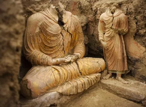 In this photograph made on Tuesday, Oct. 12, 2010 in Mes Aynak valley, south of Kabul, Afghanistan, Buddha statues are seen inside an ancient temple. The valley is the world's second-largest unexploited copper estimated to be worth nearly $1 trillion. (AP Photo/Dusan Vranic, File)