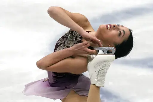 Madeline Schizas, of Canada, performs in the women short program at the Figure Skating World Championships in Montpellier, south of France, Wednesday, March 23, 2022. (AP Photo/Francisco Seco)