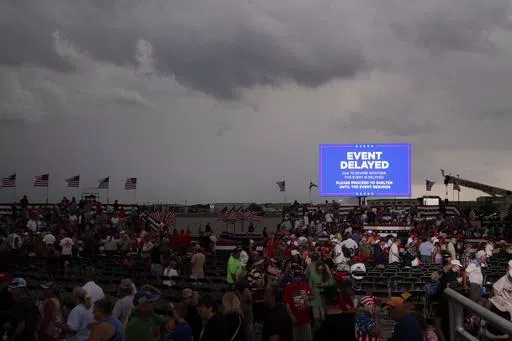 Supporters of former President Donald Trump file out of the rally after it was canceled due to threatening weather in Wilmington, N.C., Saturday, April 20, 2024. (AP Photo/Chris Seward)