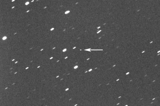 This photo provided by Gianluca Masi shows asteroid 2023 DZ2, indicated by arrow at center, about 1.8 million kilometers (1.1 million miles) away from the Earth on March 22, 2023. On Saturday, March 25, 2023, the asteroid, big enough to wipe out a city, will harmlessly zip between Earth and the moon. While asteroid flybys are common, NASA said it’s rare for one so big to come so close _ about once a decade. Scientists estimate its size somewhere between 140 feet and 310 feet. (42 meters and 94