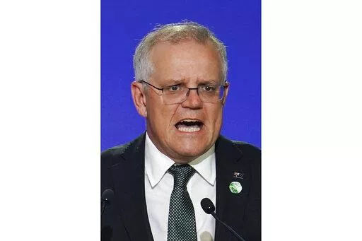 Australia's Prime Minister Scott Morrison delivers an address, during the COP26 Summit, at the SECC in Glasgow, Scotland, Monday, Nov. 1, 2021. In at least one sense, Morrison is the most successful Australian prime minister in years. He is the first to survive in office from one election to the next since 2007. That year, the government of Australia's second-longest-serving Prime Minister John Howard was voted out after a reign of almost 12 years. (Ian Forsyth/Pool Photo via AP, File)