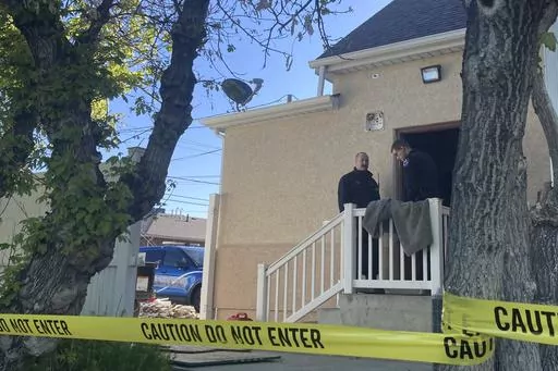 Police stand at the scene of an overnight fire that severely damaged a building that was being renovated to house a new abortion clinic in Casper, Wyo., Wednesday, May 25, 2022. With the nation's first explicit ban on abortion pills, Wyoming has pushed to the front of efforts to prohibit the most common type of abortion. (AP Photo/Mead Gruver,File)