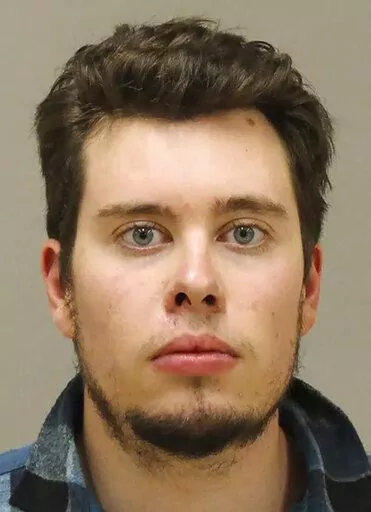 This file photo provided by the Kent County Sheriff, shows Ty Garbin. Garbin testified Wednesday in the trial in federal court in Grand Rapids, Mich., of four men charged in an alleged plot to kidnap Michigan Gov. Gretchen Whitmer. Garbin was one of six men originally charged. He pleaded guilty in January 2021 to conspiracy in the case and was sentenced to six years in prison.  (Kent County Sheriff via AP File)