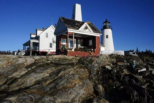 The iconic bell tower building at Pemaquid Point Light stands with makeshift modifications, Thursday, Jan. 11, 2024, in Bristol, Maine, the day after being pummeled by damaging winds and waves from powerful storm. The lighthouse represents Maine on its state quarter. (AP Photo/Robert F. Bukaty)