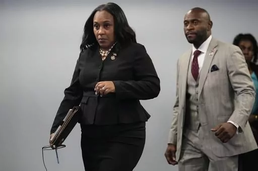 Fulton County District Attorney Fani Willis, followed by special prosecutor Nathan Wade, right, arrives for a news conference at the Fulton County Government Center, Monday, Aug. 14, 2023, in Atlanta. Willis acknowledged in a court filing on Friday, Feb. 2, 2024, having a “personal relationship” with Wade, a special prosecutor she hired for the Georgia election interference case against former President Donald Trump, but argued there are no grounds to dismiss the case or to remove her from t