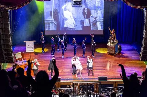 This image shows a live performance of "The Rocky Horror Picture Show" in Atlantic City, N.J., on Oct. 26, 2013. A touring, interactive version of “The Rocky Horror Picture Show” is hitting the road to celebrate the cult film’s birthday with screenings, live shadow casts. (Dennis Parrington via AP)