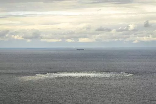 In this photo provided by the Armed Forces of Denmark, a view the disturbance in the water above the gas leak,  in the Baltic Sea, Thursday, Sept. 29, 2022. Following the suspected sabotage this week of the Nord Stream 1 and 2 pipelines that carry Russian natural gas to Europe, there were two leaks off Sweden, including a large one above North Stream 1, and a smaller one above North Stream 2.  (Rune Dyrholm/Armed Forces of Denmark via AP)